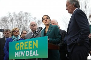 representative_alexandria_ocasio-cortez_center_speaks_on_the_green_new_deal_with_senator_ed_markey_right_in_front_of_the_capitol_building